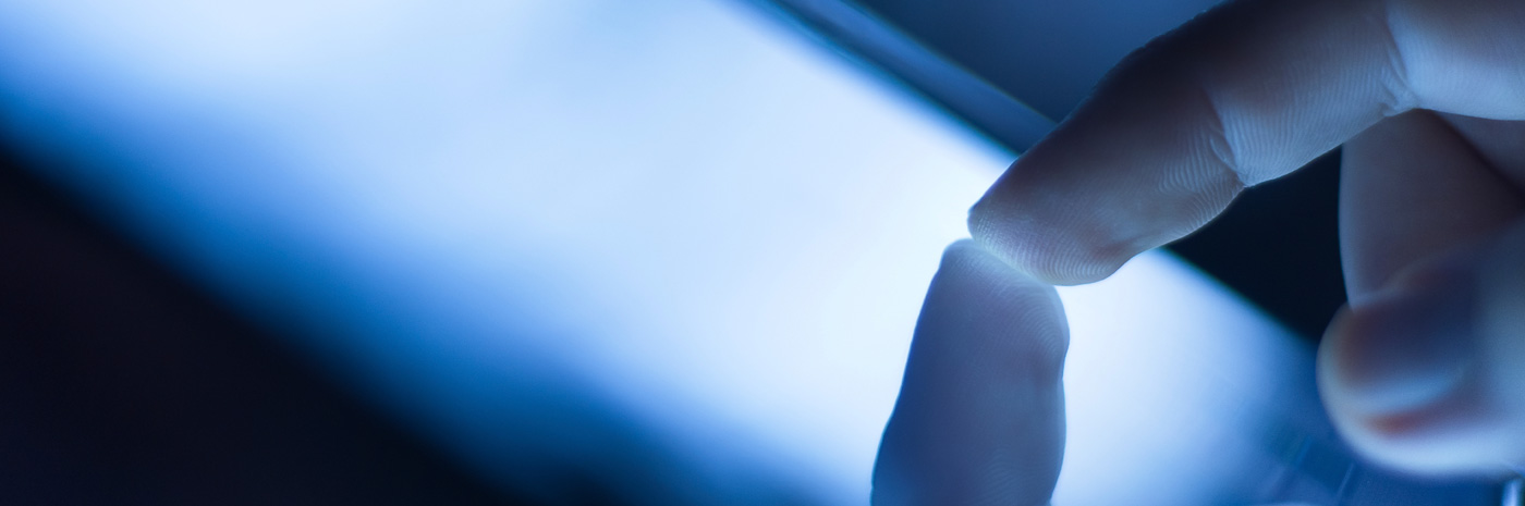 Finger touching a screen