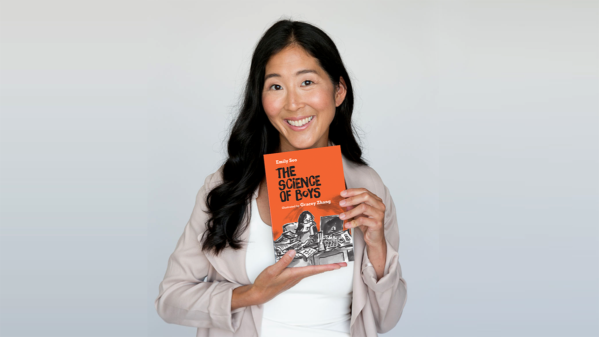 Headshot of Emily Seo holding her book