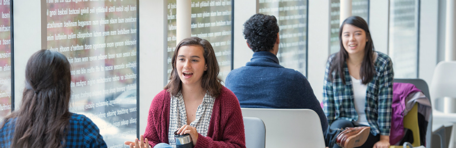 Students smiling and chatting with each other
