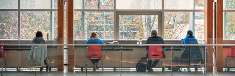 A view of 4 students working a table.